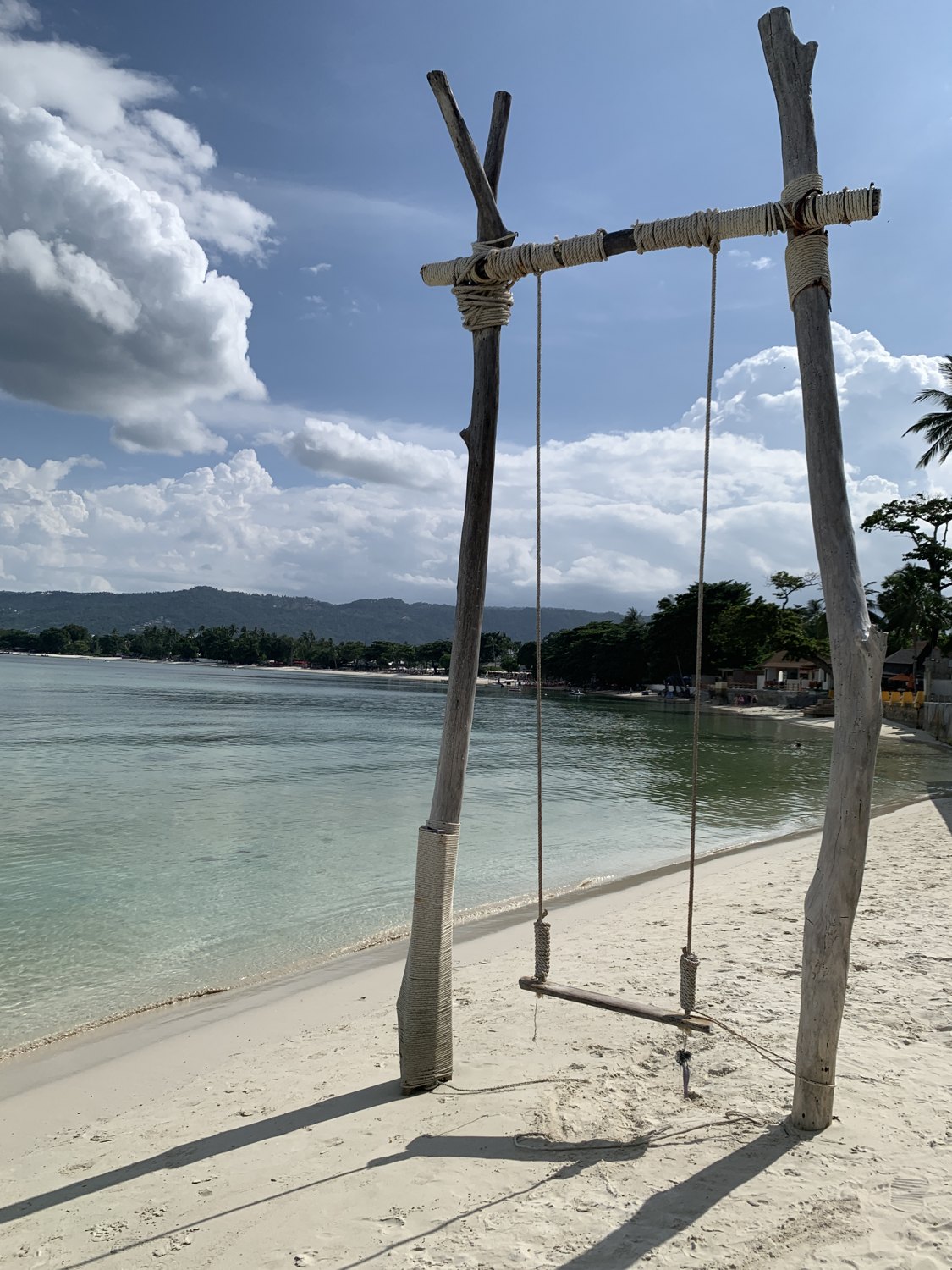 A swing overlooking the calm sea in Koh Samui